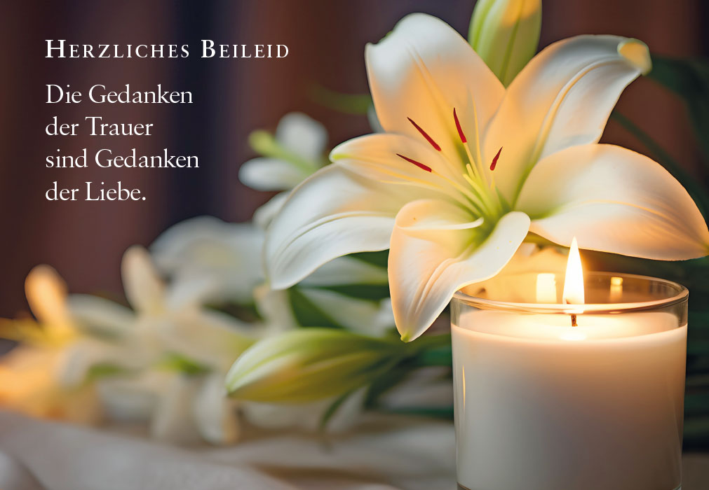 Trauer - weiße Lilie neben Kerze