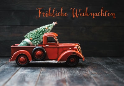Weihnachten - rotes Spielzeugauto mit Baum 