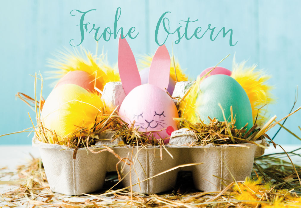 Ostern - bunte Eier, bunte Federn in Eierschachtel